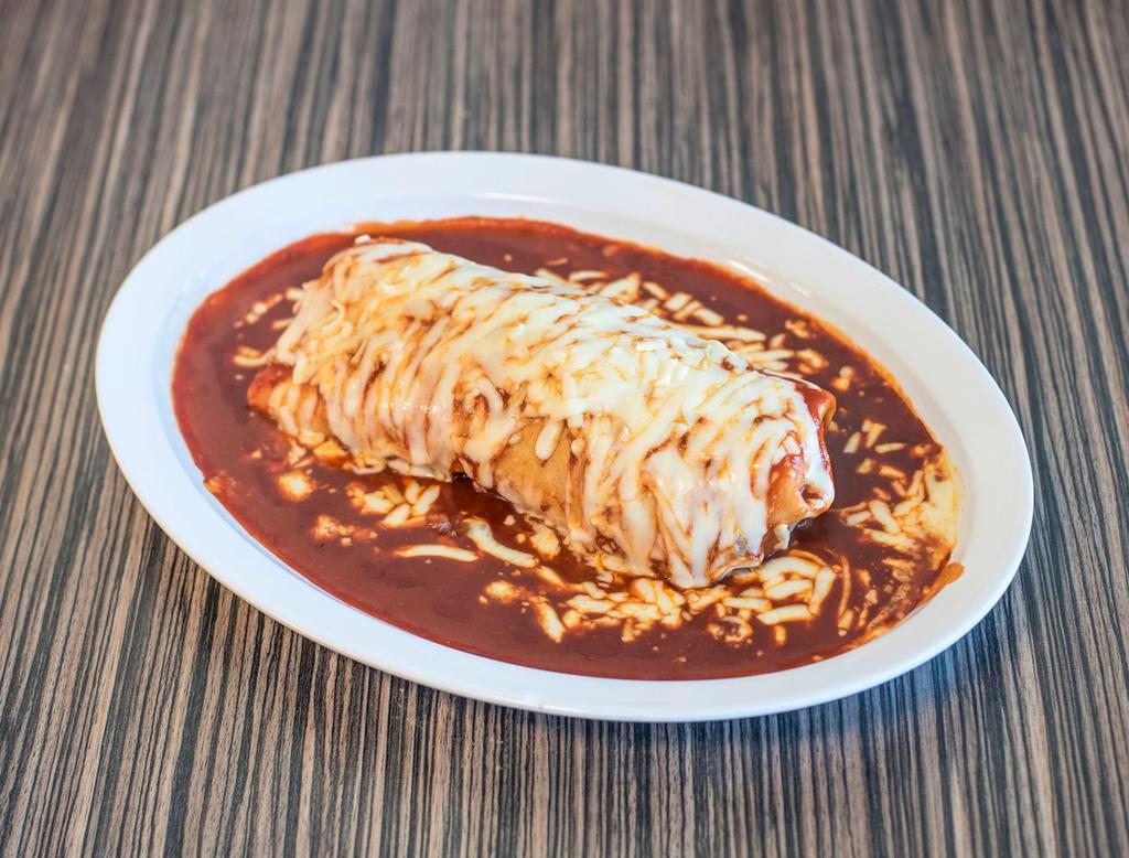Wet Super Burrito · Your choice of meat, refried beans, rice, cheese, sour cream, pico de Gallo covered with mole sauce and cheese.