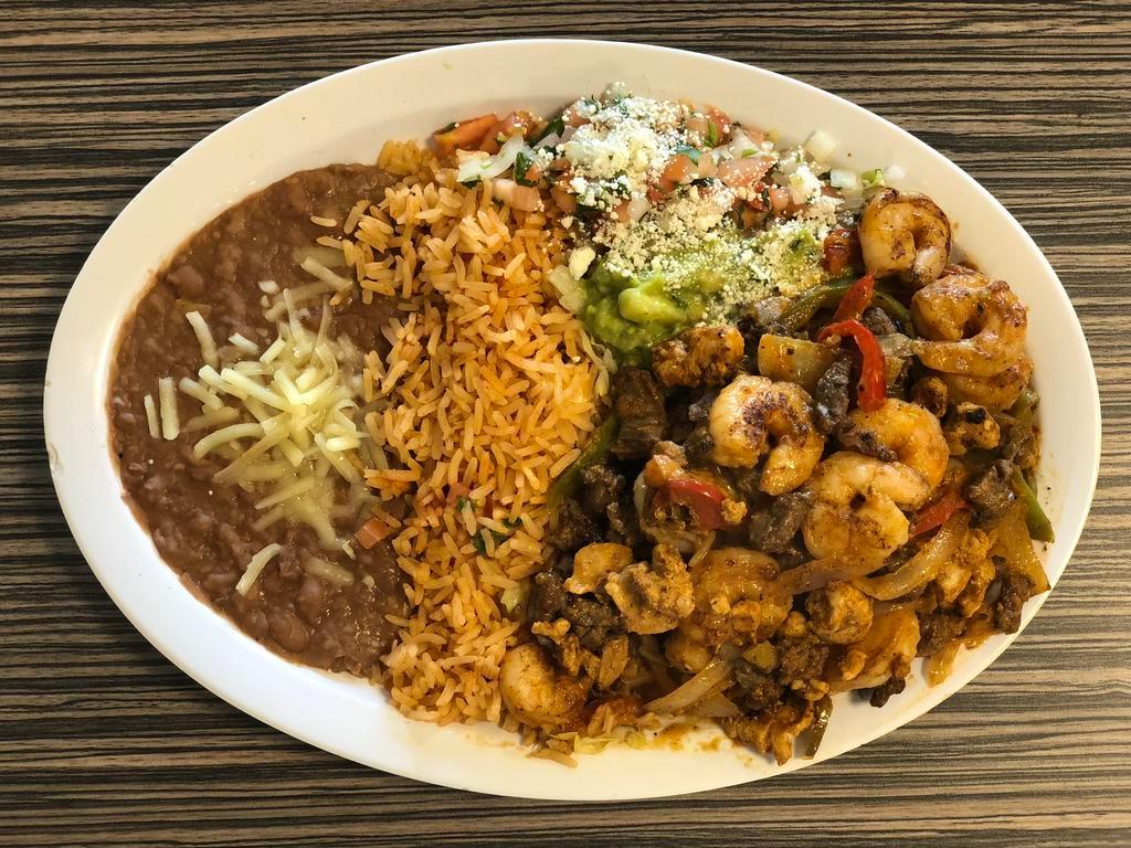 Mixed Fajitas Platillo · Shrimp, chicken and steak sautéed with bell pepper and onions with a side of rice, beans, pico de gallo, guacamole and tortillas.