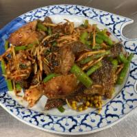 3. Catfish with Chili Sauce · Deep fried catfish stir-fried with chili paste, basil leaves, young green pepper and shredde...