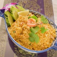 4. Pineapple Fried Rice · Fried rice with egg, shrimp, chicken, cashew nuts, raisin, onions, pineapple chunks and Chin...
