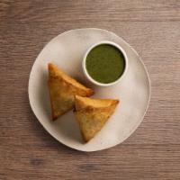 Vegetable Samosa · A fried pastry with a savory potato filling.