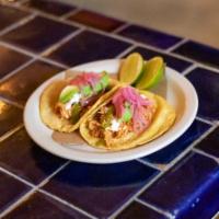 Tinga Tacos · Chicken cooked in chipotle, serrano-avocado salsa, pickled red onions, creme, avocado (2 per...