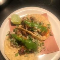 Carnitas Tacos · Braised pork, salsa serrano, salsa roja, onions cilantro (2 per order)