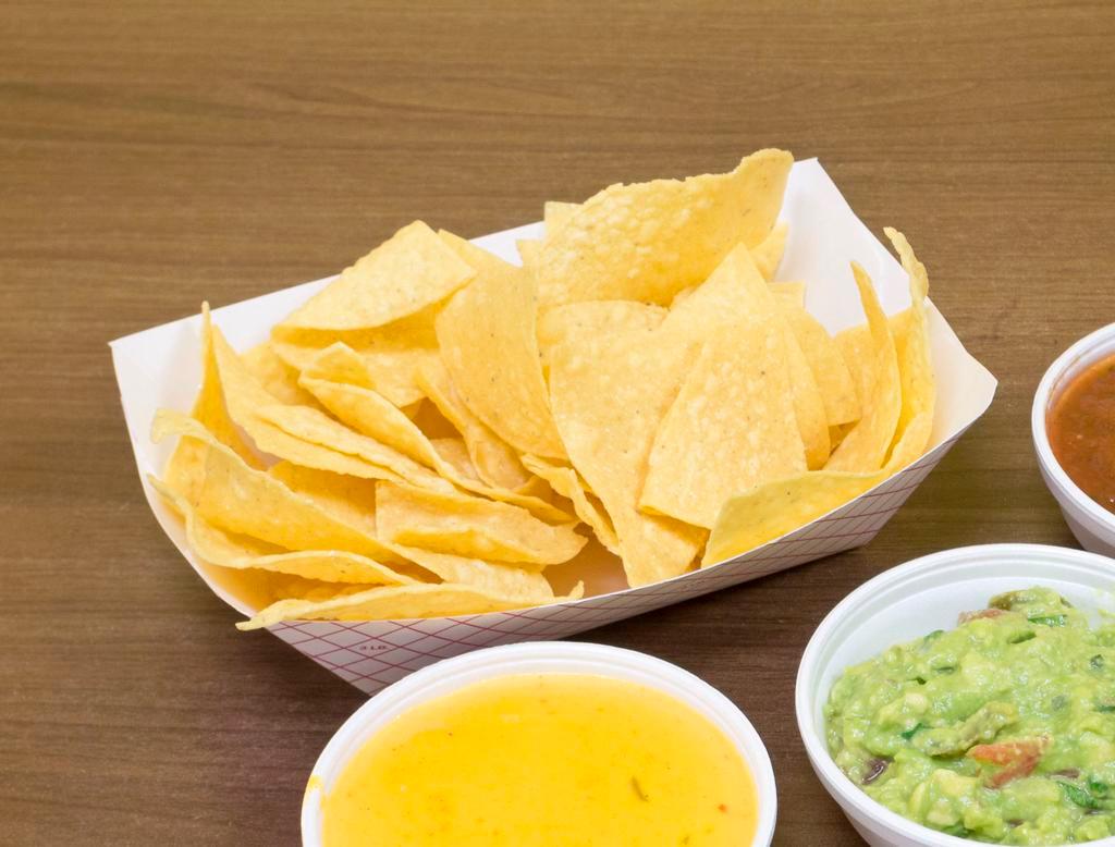 The Trio · Chips served with queso, guacamole and salsa roja.