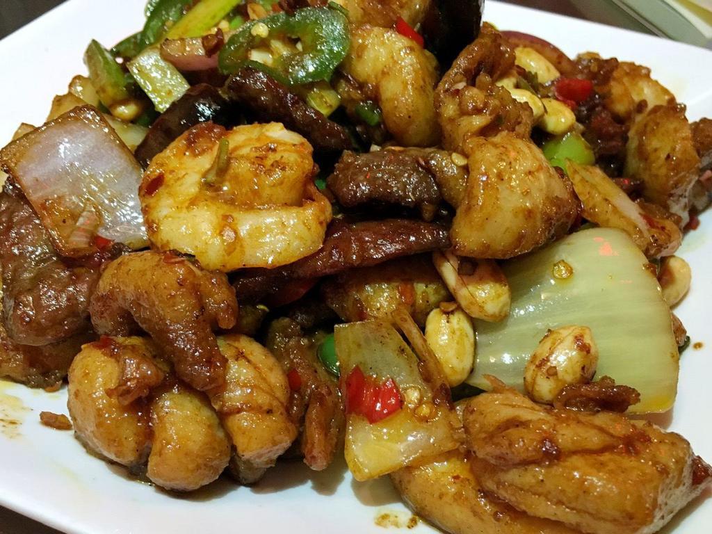 Kung Pao Triple Delight · Chicken, beef and shrimp. Served with steamed rice. Hot and spicy.