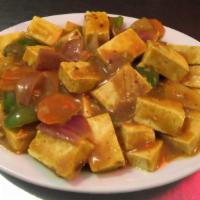 Curry Tofu · Organic tofu. Served with steamed rice. Hot and spicy.