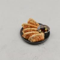 A.1 Gyoza · Pan fried pot stickers stuffed with seasoned vegetables and pork with dipping sauce.