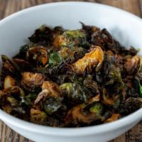 Brussel Sprouts · Fried brussel sprouts, lemon, creeper dressing, agave, rice crispies.