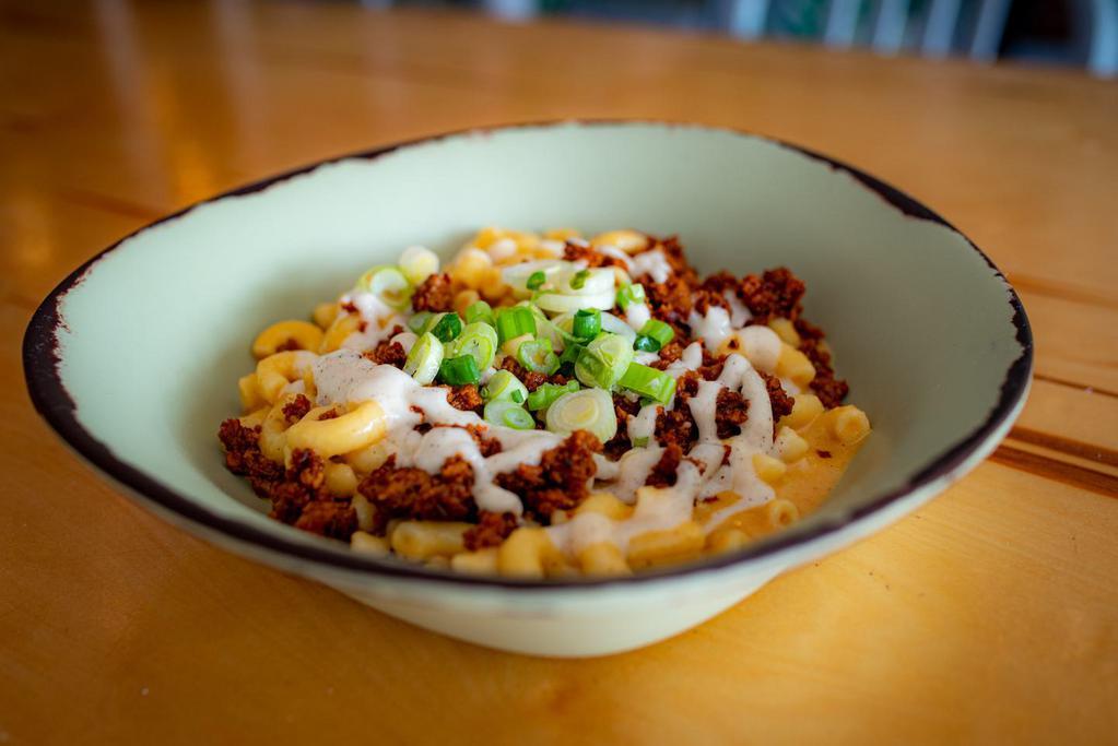 Loaded Mac and Cheese · All loaded items come with melted cheeze, garlic aioli + scallion

Choose 1 additional topping: chipotle sausage crumble, walnut meat, chili, black beans, or broccoli /cauliflower confetti
