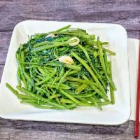 Rau Muong Xao Toi · Water spinach stir-fried with garlic.