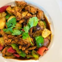 Ga Xao Sa Ot · Vietnamese aromatic lemongrass chicken with bell peppers and onions.