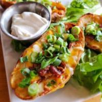 Crispy Potato Skins · Melted cheese, bacon, green onions and sour cream.