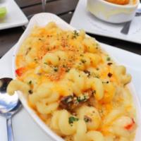 Lobster Mac and Cheese · Lobster meat, freshly made cavatappi, mushrooms, onions, house made Alfredo sauce, mozzarell...