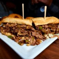 Philly Cheesesteak Sandwich · Thinly sliced steak, bell pepper, onion, provolone cheese. Served on a hoagie roll with choi...