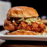 Spicy Crispy Chicken Sandwich · Fried breast with our spice blend, slaw, pickles, and remoulade. Served on a toasted bun wit...