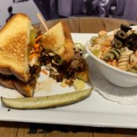 Pulled Pork Melt · Grilled thick-cut Texas-style bread, pulled pork, pepper-Jack cheese, slaw, pickles, and our...