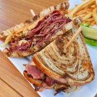 Almost Reuben Melt · Grilled rye bread topped with delicious pastrami, sauerkraut, Swiss cheese, and 1000 Island ...