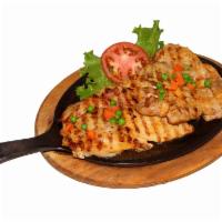 Grilled chicken thigh - PIERNA DE POLLO A LA PARRILLA (Cooking time 25 minutes) · with white rice, french fries and salad - CON ARROZ, PAPAS FRITAS Y ENSALADA