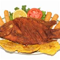 Fried tilapia - MOJARRA FRITA · with white rice, fried cassava, green plantains and salad - CON ARROZ, YUCA FRITA, TOSTONES ...