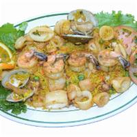 Sauteed seafood platter - SALTEADO DE MARISCOS · with white rice, french fries and salad - CON ARROZ BLANCO, PAPAS FRITAS Y ENSALADA