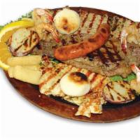 PARRILLADA · Grilled steak, pork, 1/4 chicken, sausage, corn cake, cassava, potato, salad, rice, beans an...
