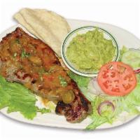 Sirloin steak in Mexican style sauce - STEAK TAMPIQUEÑA · Sirloin steak in mexican style sauce, guacamole, yellow rice, beans, tortillas and salad - C...