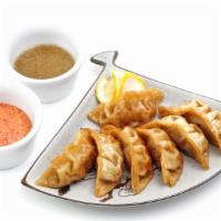 A3. Chicken Dumplings · Steamed or fried dumplings with chicken and vegetable. 8 pieces.