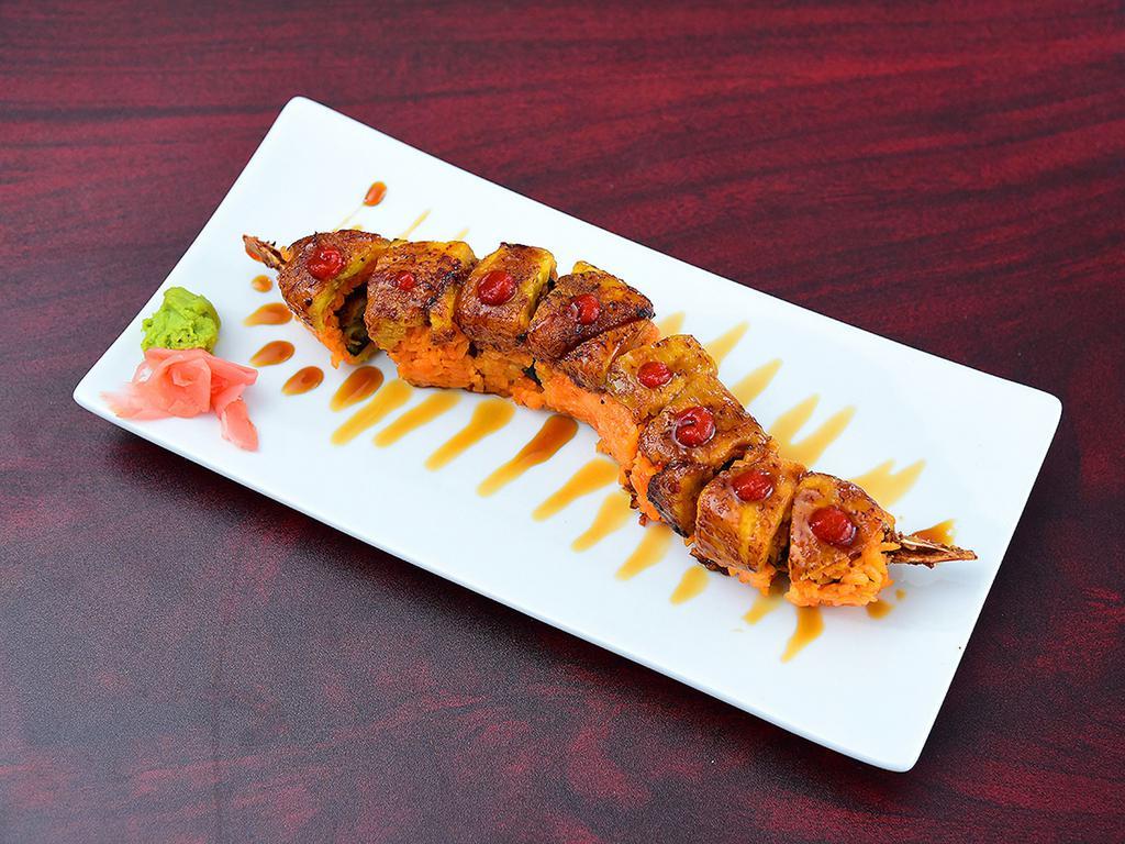 Merengue Roll · Beer batter shrimp, bacon, Sriracha, avocado, topped with sweet plantains and stingray sauce.