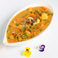 Navratan Korma · Jewel veggies cooked in creamy mild sauce.