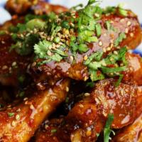 Dala Wings 6 pc · Fried crispy chicken wings served in a sweet and spicy sauce.
