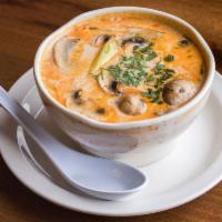 Tom Yum Soup (GF) · Hot and sour soup with mushroom, tomato, onion and cilantro. 