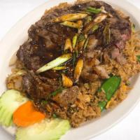 Thai Steak · House steak lightly seasoned over a choice of fried rice or stir fry vegetables topped with ...
