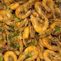 Salt & Pepper Shrimp (GF) · Lightly breaded shell shrimp deep fried served with onions, garlic and spice over bed of let...