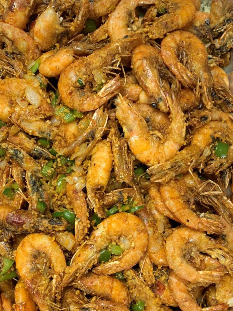 Salt & Pepper Shrimp (GF) · Lightly breaded shell shrimp deep fried served with onions, garlic and spice over bed of lettuce