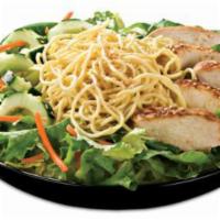 Sesame Garden Salad · Grilled marinated chicken breast, sliced cucumbers, carrots and yakisoba noodles on a bed of...