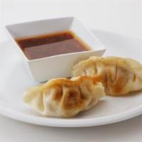 Potstickers · 3 potstickers. A blend of pork and vegetables wok-seared served with a spicy soy dipping sau...