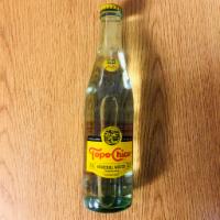 Topo Chico   · Carbonated Mineral Water in a glass bottle. 