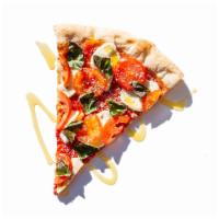 Caprese Pizza · Fresh mozzarella, fresh basil and sliced tomatoes. 