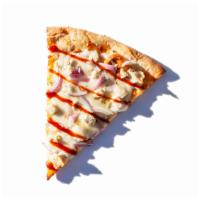 The Taranchula Pizza · Ranch chicken, red onions, extra melted mozzarella and BBQ sauce. 