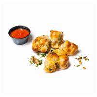 Garlic Knots · Order of 5. Served with a side of our own marinara sauce.