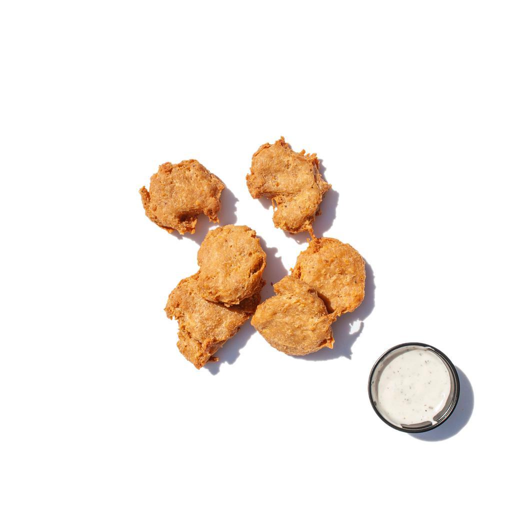 Vegan Chicken Nuggets  · Delicious fried vegan chicken nuggets with a choice of vegan blue cheese, ranch or hot sauce on the side. 