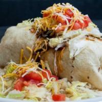 Grilled Steak Burrito · Sautéed Onions, Peppers & Tomatoes
with Cheese, Lettuce & choice of Beans