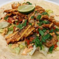 Open-Face Burrito Shrimp & Salmon  · Marinated Shrimp & Salmon, Rice,
Lettuce, Pico De Gallo on a grilled Flour
Tortilla with Hon...