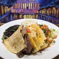 Grilled Steak Quesadilla · Crispy Grilled Flour Tortillas, filled
with Green Chilies and Shredded
Cheese. Served over r...