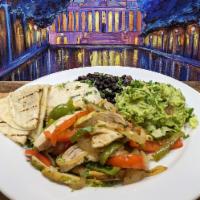 Grilled Chicken Fajita · Served over rice with Sautéed Onions,
Sweet Bell Peppers, Tomatoes, 2 Flour
Tortillas, with ...