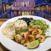 Grilled Shrimp Fajita · Served over rice with Sautéed Onions,
Sweet Bell Peppers, Tomatoes, 2 Flour
Tortillas, with ...