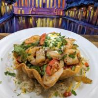 Grilled Shrimp Taco Salad · A Crispy Flour Tortilla bowl on a bed of Rice, filled with grilled Salmon, with choice of Be...