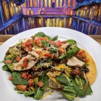 Grilled Chicken Tostada salad · Two Crispy Corn Tortillas topped with Fresh Baby Spinach, Slices of Grilled Chicken, Tomatoe...