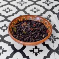 Charro Beans · Black beans with onion, peppers and salt.