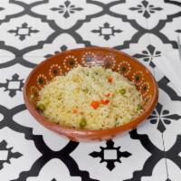 Mexican Rice · Authentic Mexican rice with peas, carrots, corn and seasoning. 